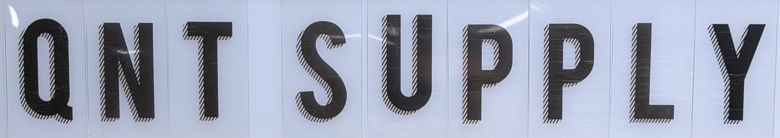 A picture of a sign that reads QNT Supply